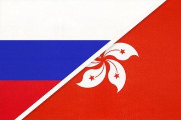 Russia vs Hong Kong national flag from textile. Relationship and partnership between two countries.