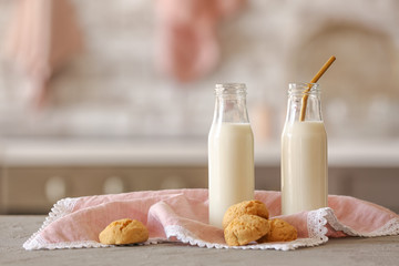Bottles of milk and cookies on kitchen table