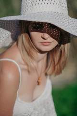 Pretty blonde in beach hat