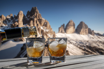 Drink for two in the high mountains - Two glasses of liqueur for a carefree holiday concept for a...