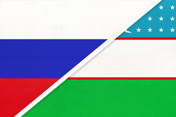 Russia vs Uzbekistan national flag from textile. Relationship and partnership between two countries.