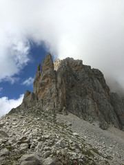 Mountain peak between clouds