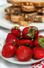 Unrecognizable woman having breakfast in pajamas at home in quarantine