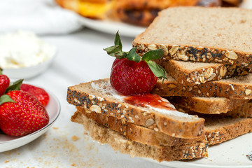 Unrecognizable woman having breakfast in pajamas at home in quarantine