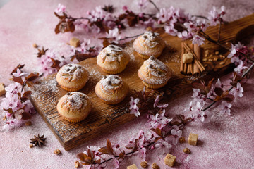 Fototapeta premium Fresh baked cupcakes of rice flour with banana and vanilla with a mug of hot chocolate