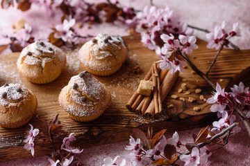 Fresh baked cupcakes of rice flour with banana and vanilla with a mug of hot chocolate