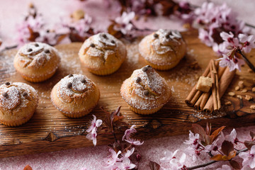 Fresh baked cupcakes of rice flour with banana and vanilla with a mug of hot chocolate