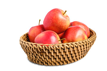 Group of apples in basket isolated on white background with clipping path.