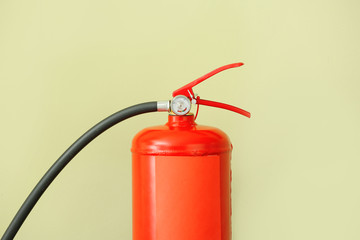 Obraz premium Fire extinguisher on color background