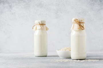 Homemade diet vegetable milk made from rice on a gray background. Diet healthy concept. Copy space and Banner.Top view.