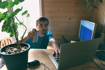 freelance programmer drinks and write code, work from home in quarantine, lifestyle workspace and...