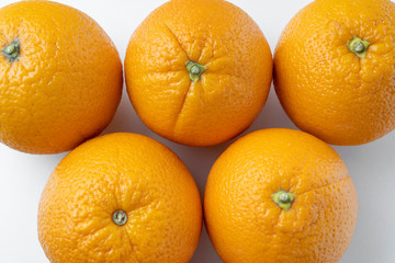 fresh oranges on a white background close up