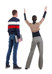 Fototapeta premium Back view couple with laptop in sweater.
