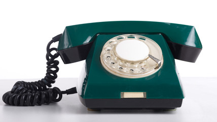 Retro phone with dial dial on a white background.