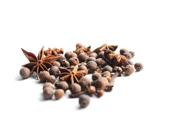 On white background anise, black pepper, allspice. Healthy eating concept. Background to insert text or spice catalog