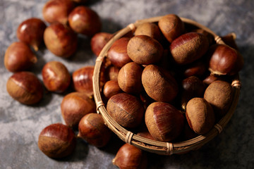 Heap of chestnuts in bamboo bowl 