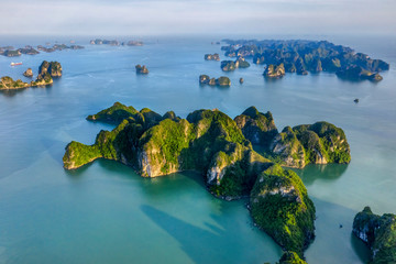 Aerial view floating fishing village and rock island, Halong Bay, Vietnam, Southeast Asia. UNESCO World Heritage Site. Junk boat cruise to Ha Long Bay. Popular landmark, famous destination of Vietnam © Hien Phung