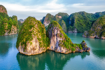 Aerial view floating fishing village and rock island, Halong Bay, Vietnam, Southeast Asia. UNESCO World Heritage Site. Junk boat cruise to Ha Long Bay. Popular landmark, famous destination of Vietnam © Hien Phung
