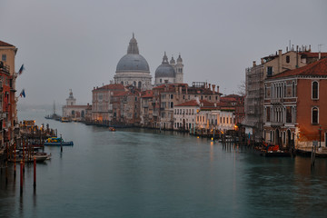 View of the Grand Canal and the Basilica Santa Maria della Salute on morning fog
