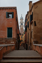 Venice Italy, February 17 2020. Walking on streets of Venice and in the background the catholic church Parrocchia di San Pantalon
