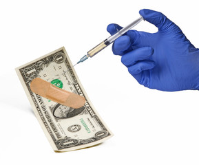 Medicc saving the USA economy from health crisis injecting medicine on dollar bill.
