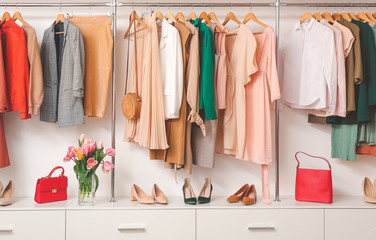 Modern wardrobe with stylish spring clothes and accessories