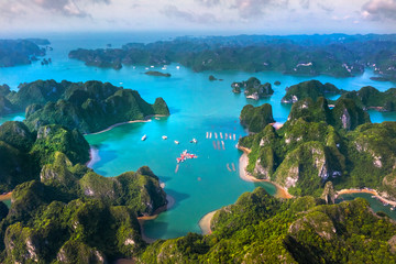 Aerial view of Sang cave and Kayaking area, Halong Bay, Vietnam, Southeast Asia. UNESCO World Heritage Site. Junk boat cruise to Ha Long Bay. Popular landmark, famous destination of Vietnam