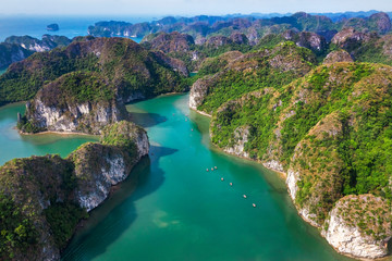 Fototapeta na wymiar Aerial view of Sang cave and Kayaking area, Halong Bay, Vietnam, Southeast Asia. UNESCO World Heritage Site. Junk boat cruise to Ha Long Bay. Popular landmark, famous destination of Vietnam