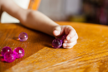 baby develops, counting balls and fine motor skills development of hands, different colors and surfaces, mental development, daughter, child, girl