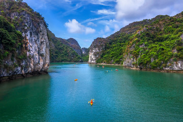 Fototapeta na wymiar Aerial view of Sang cave and Kayaking area, Halong Bay, Vietnam, Southeast Asia. UNESCO World Heritage Site. Junk boat cruise to Ha Long Bay. Popular landmark, famous destination of Vietnam