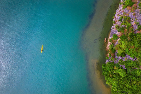 Aerial view of Sang cave and Kayaking area, Halong Bay, Vietnam, Southeast Asia. UNESCO World Heritage Site. Junk boat cruise to Ha Long Bay. Popular landmark, famous destination of Vietnam