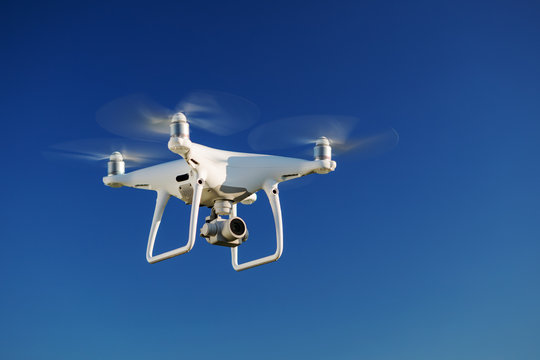 drone flying over the blue sky background