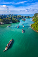 Aerial view Vung Vieng floating fishing village and rock island, Halong Bay, Vietnam, Southeast Asia. UNESCO World Heritage Site. Junk boat cruise to Ha Long Bay. Famous destination of Vietnam © Hien Phung