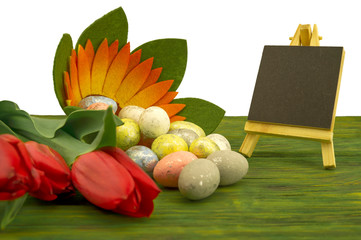 Red spring tulips and painted eggs