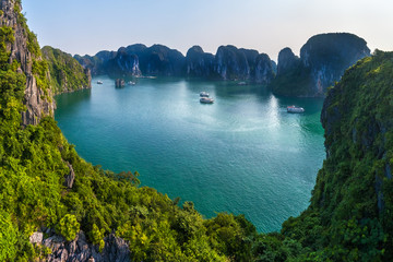 Aerial view floating fishing village and rock island, Halong Bay, Vietnam, Southeast Asia. UNESCO World Heritage Site. Junk boat cruise to Ha Long Bay. Popular landmark, famous destination of Vietnam © Hien Phung