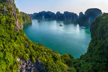 Aerial view floating fishing village and rock island, Halong Bay, Vietnam, Southeast Asia. UNESCO...
