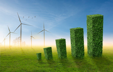 Bar chart increasing, made by green bushes shaped on wind turbine and a flock of birds background....
