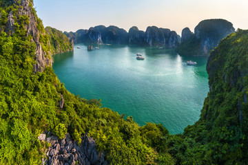 Aerial view floating fishing village and rock island, Halong Bay, Vietnam, Southeast Asia. UNESCO World Heritage Site. Junk boat cruise to Ha Long Bay. Popular landmark, famous destination of Vietnam © Hien Phung