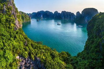 Aerial view floating fishing village and rock island, Halong Bay, Vietnam, Southeast Asia. UNESCO World Heritage Site. Junk boat cruise to Ha Long Bay. Popular landmark, famous destination of Vietnam © Hien Phung