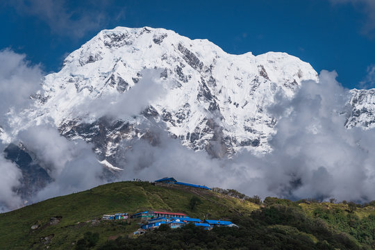 Annapurna south mountain peak behind Badal Danda village in Mardi Himal trekking route in Pokhara, Himalaya mountains range in Nepal