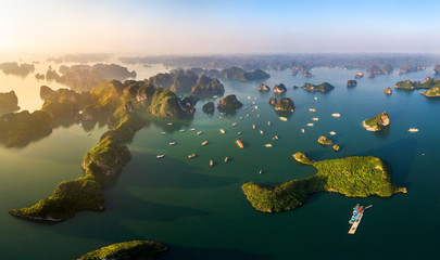 Aerial view floating fishing village and rock island, Halong Bay, Vietnam, Southeast Asia. UNESCO World Heritage Site. Junk boat cruise to Ha Long Bay. Popular landmark, famous destination of Vietnam © Hien Phung