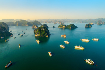 Aerial view floating fishing village and rock island, Halong Bay, Vietnam, Southeast Asia. UNESCO World Heritage Site. Junk boat cruise to Ha Long Bay. Popular landmark, famous destination of Vietnam © Hien Phung