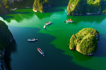Aerial view floating fishing village and rock island, Halong Bay, Vietnam, Southeast Asia. UNESCO World Heritage Site. Junk boat cruise to Ha Long Bay. Popular landmark, famous destination of Vietnam © Hien Phung