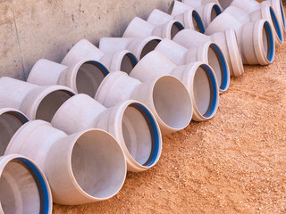 Plastic parts of sewage pipeline system at construction site