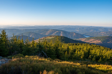 Beautiful view of mountains covered with spruces and dam in valley, Czech Beskydy