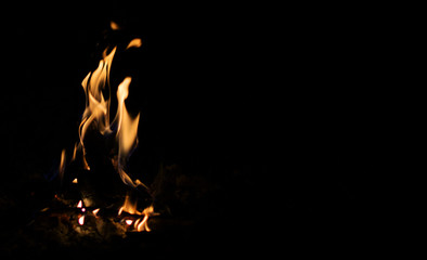 A beautiful campfire isolated  on a black background. Copy space.