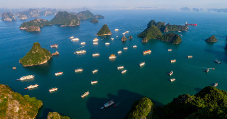 Aerial view floating fishing village and rock island, Halong Bay, Vietnam, Southeast Asia. UNESCO World Heritage Site. Junk boat cruise to Ha Long Bay. Popular landmark, famous destination of Vietnam © Hien Phung