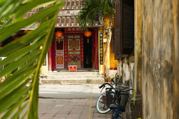 hoi an traditional and tiny street in vietnam, with old buildings and yellow color
