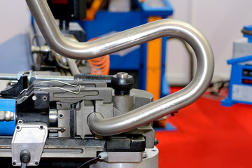 Fototapeta Industrial machine for bending steel pipes and metal rods. Pipe bending machine obraz