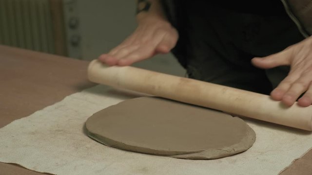 Ceramist work in the workshop.